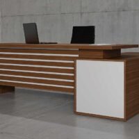 Glax L Shaped Executive Desk with white leg, featuring lockable drawers and open shelves, from Highmoon Office Furniture UAE.